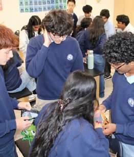 Short Circuit and RISE members preparing custom 3D-printed gifts.